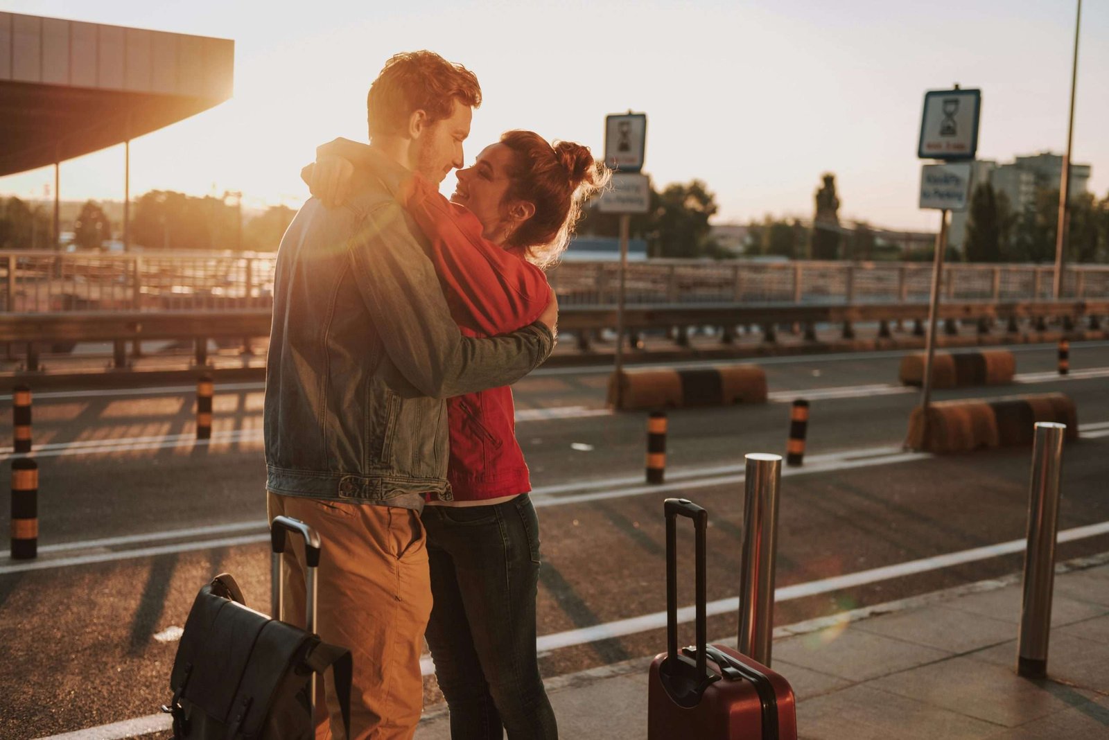 A couple giving a hug before traveling to romantic cities in Europe