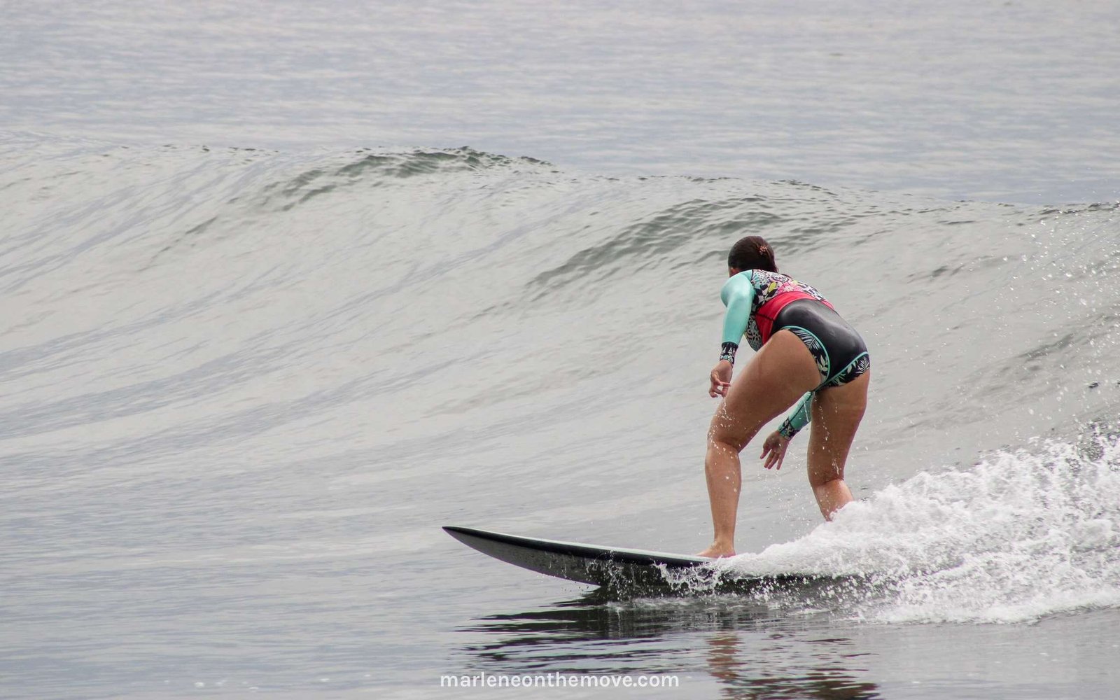 Marlene On The Move author surfing in El Salvador
