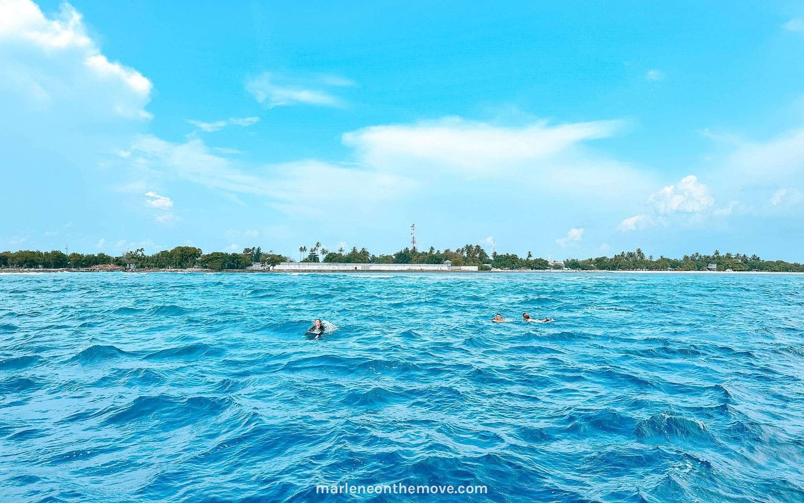 The surfer girls returning from a surf session on Jailbreaks