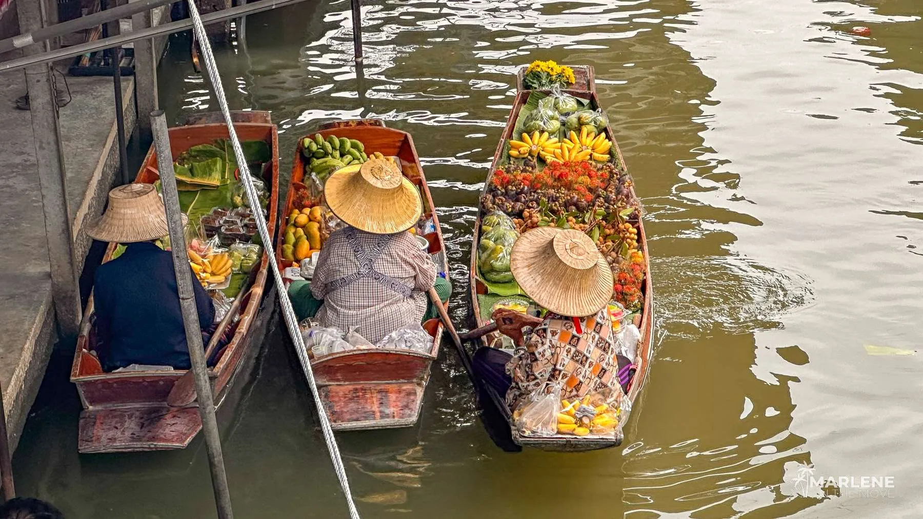 Overhead view of food-filled boats at the floating market