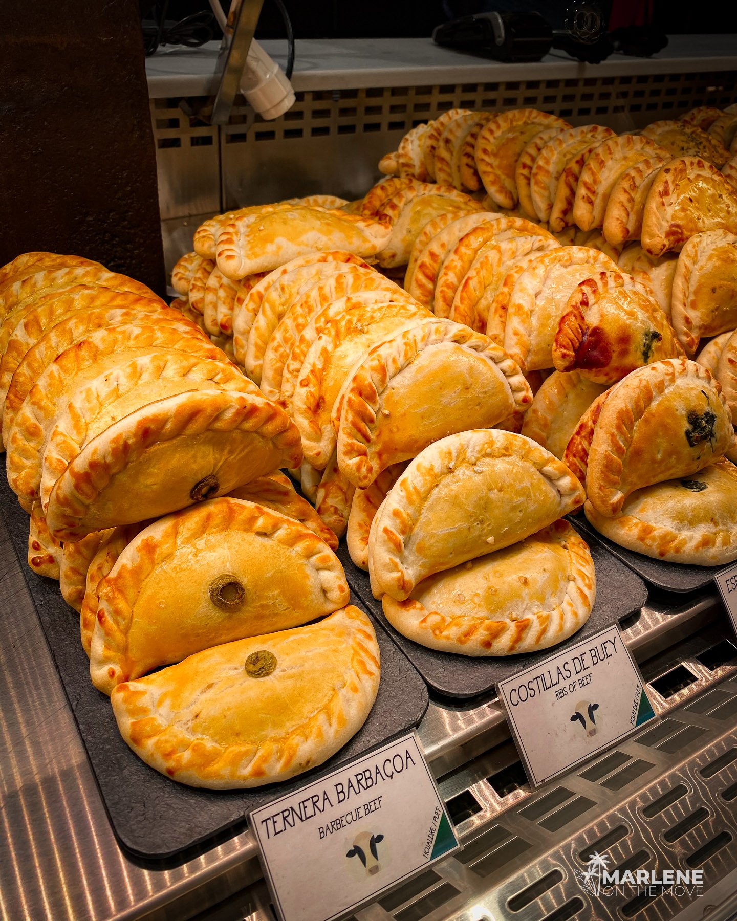 Fresh pastries are displayed at Mercado de San Miguel in Madrid, a traditional Spanish food market.