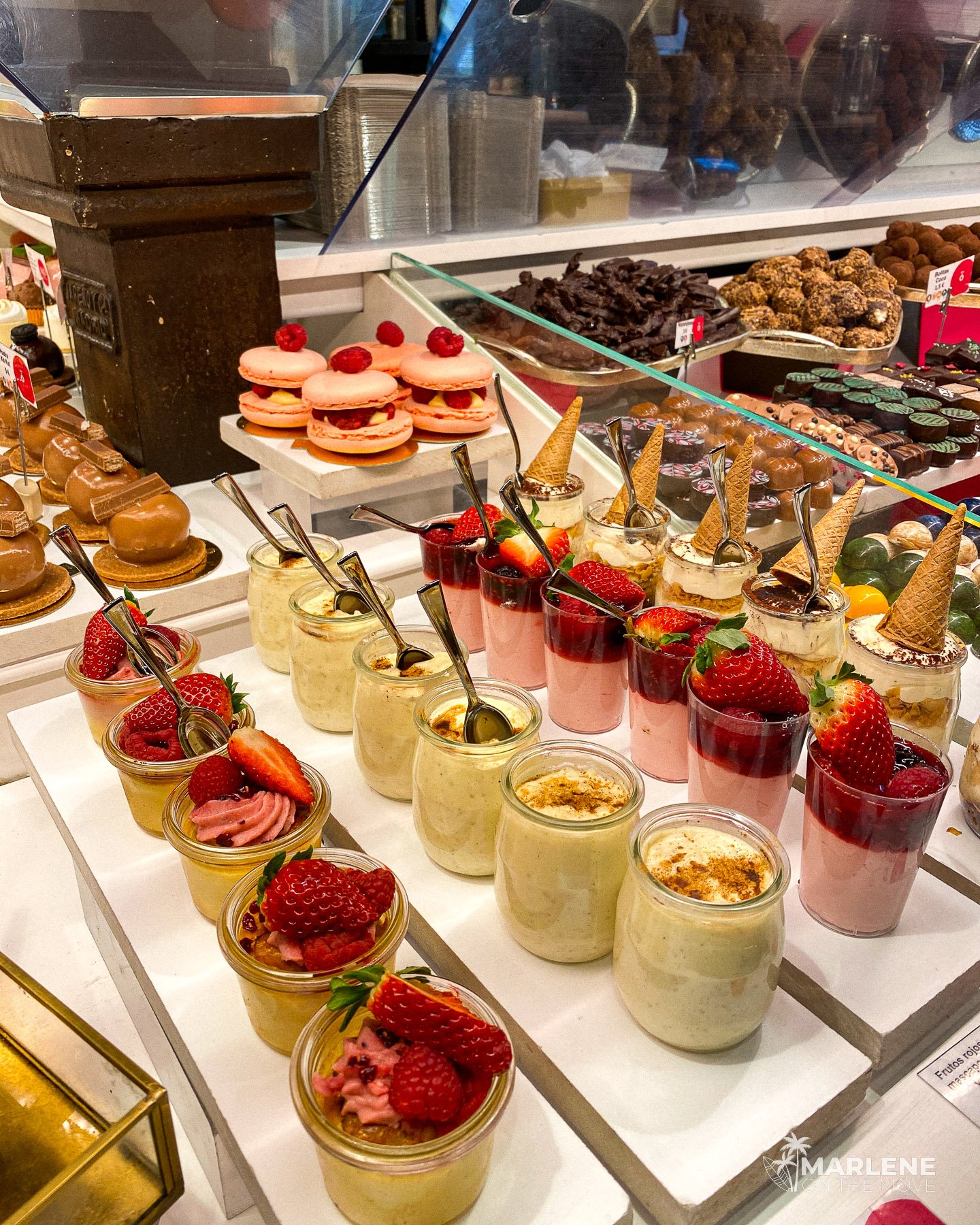 Sweets stall at Mercado de San Miguel in Madrid, a traditional Spanish food market.