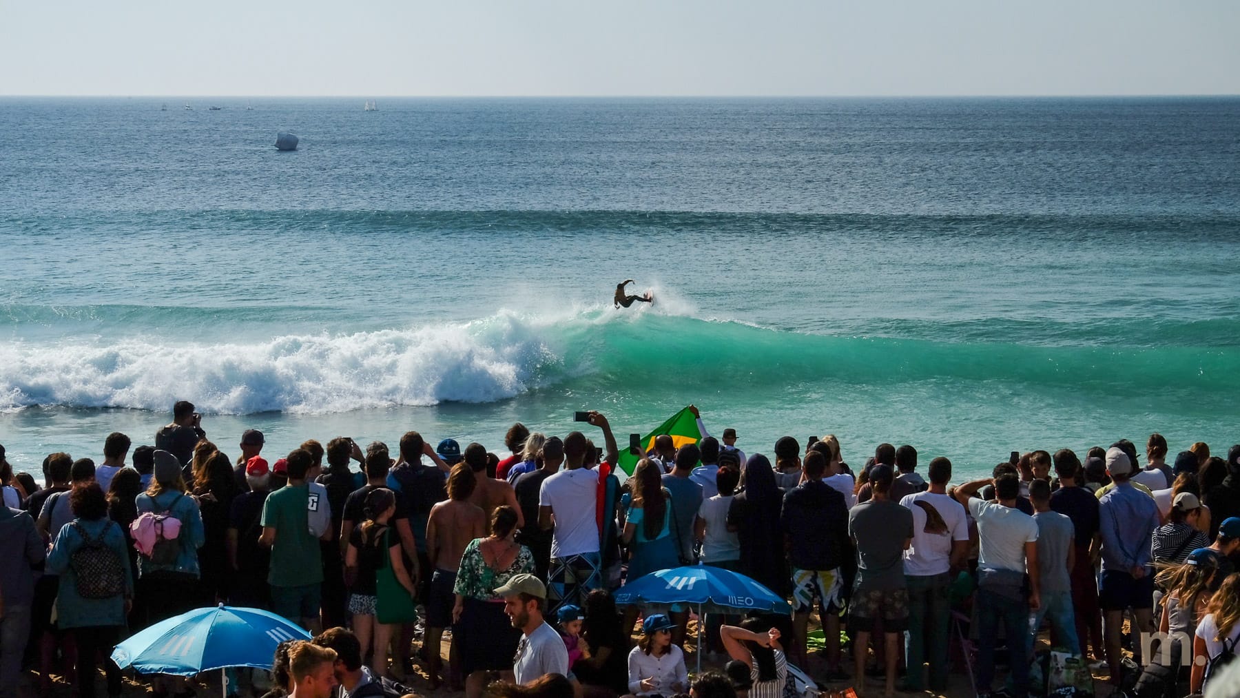 Crowd on the beach watching the world surfing championship at Supertubos, Peniche