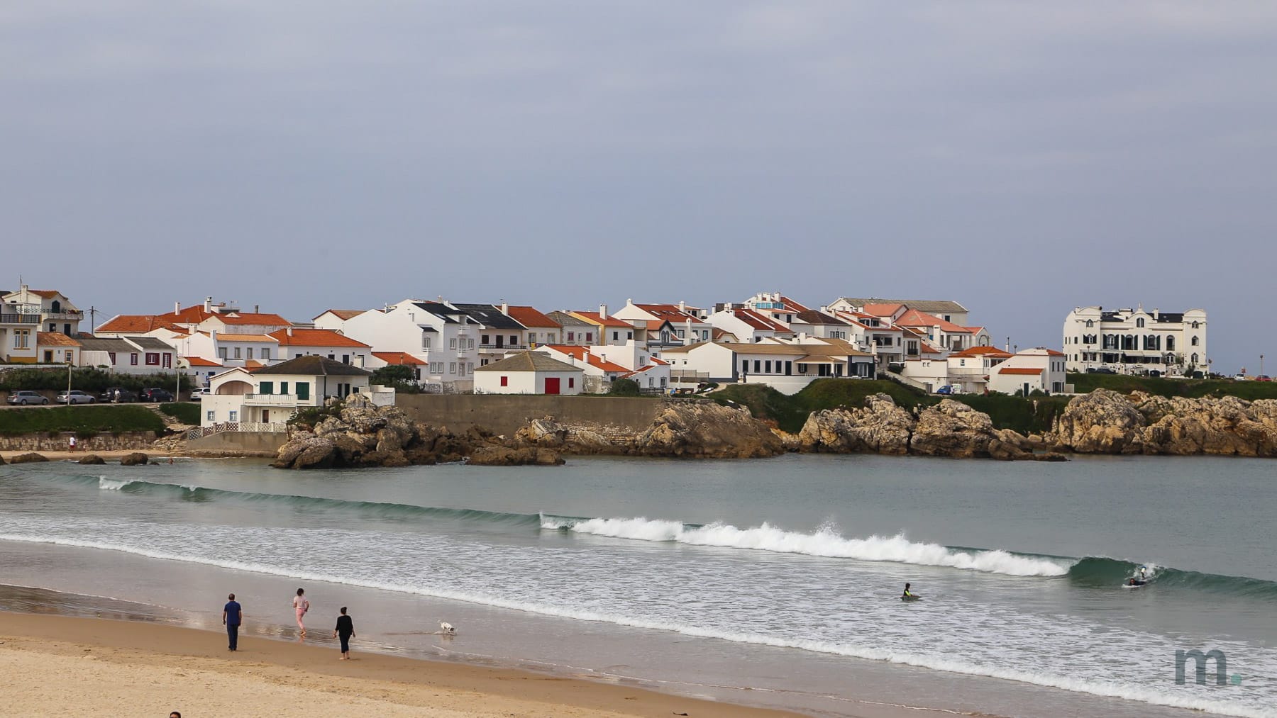 Surfers at Prainha, next to Baleal island, Peniche