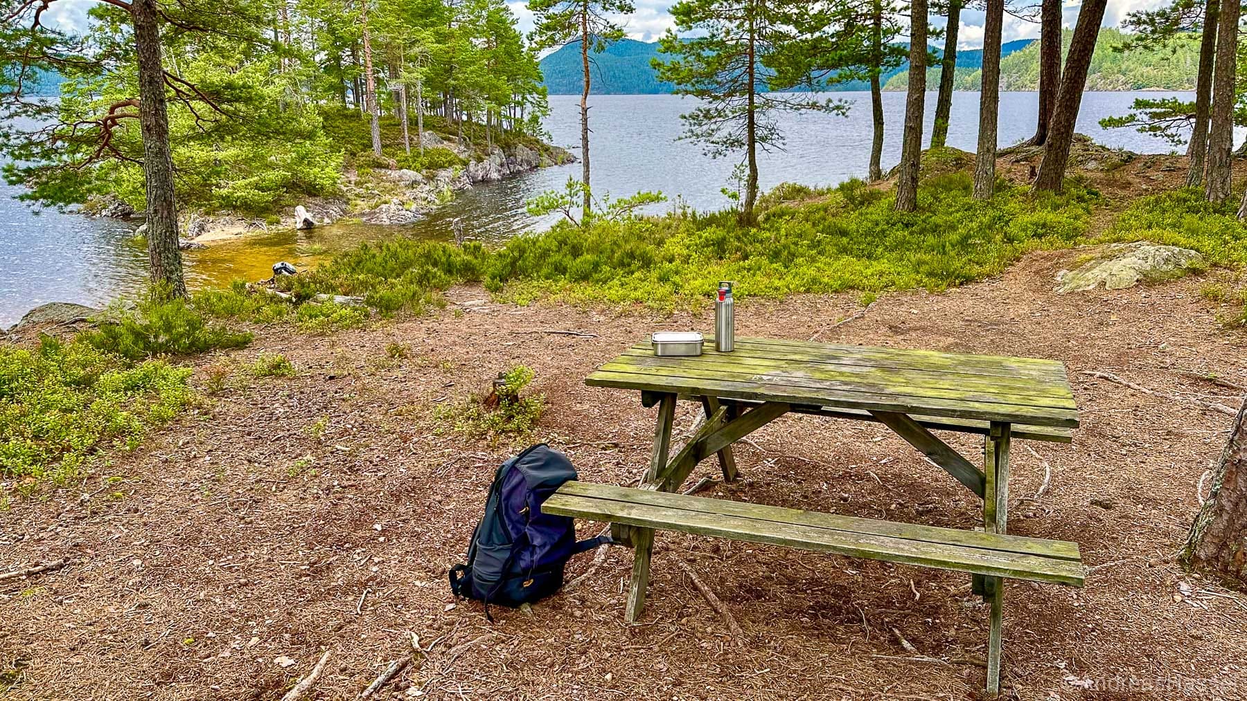 Pic-nic table in an norwegian forest near a river